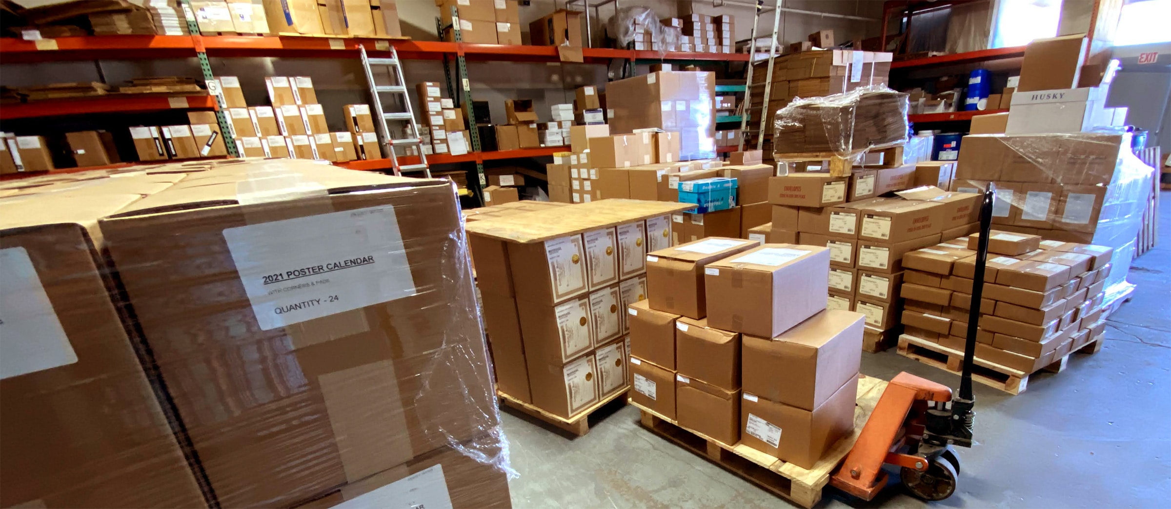 A high quality warehouse filled with boxes and pallets for printing purposes.